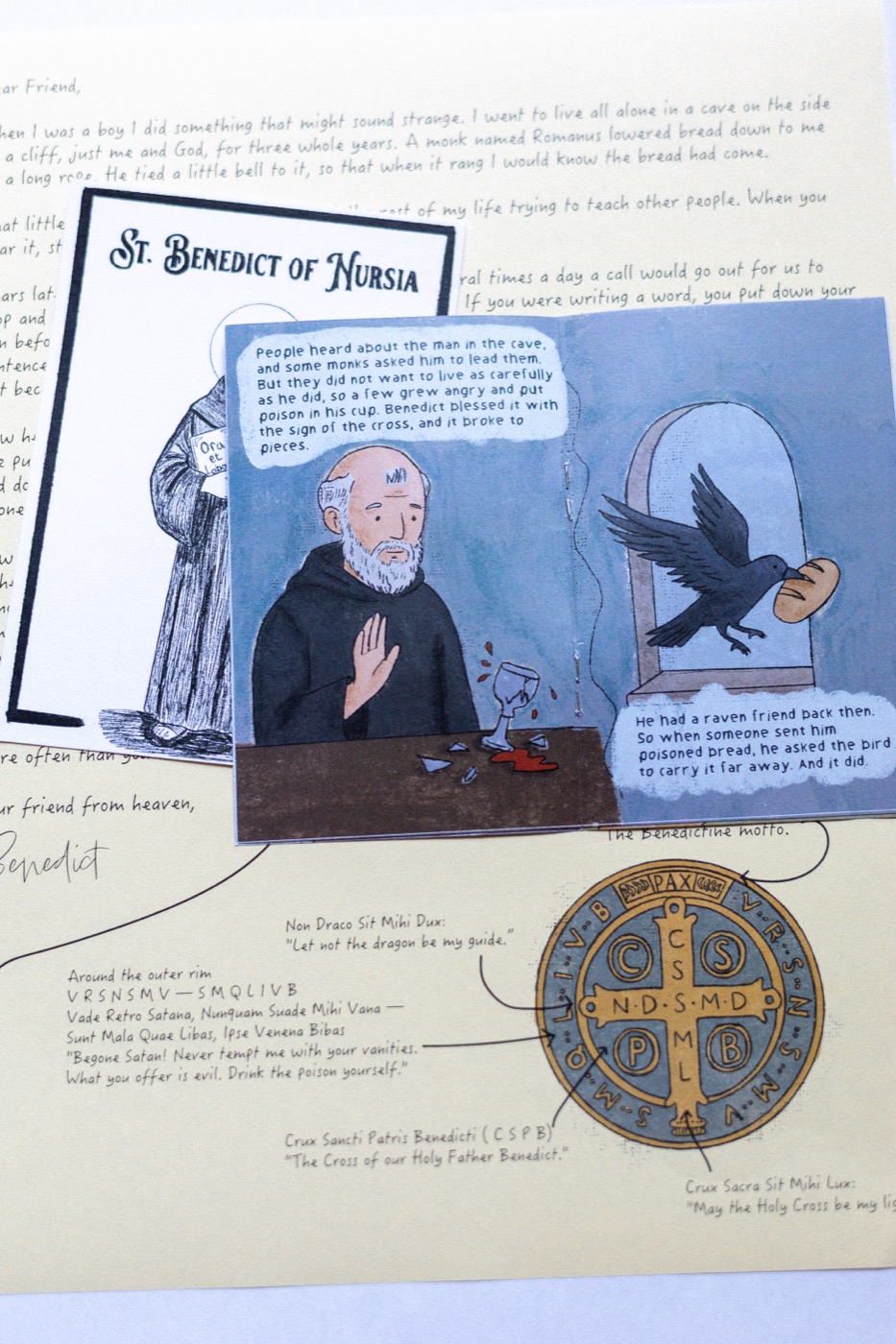 St. Benedict's hand-drawn zine, open to the spread where the poisoned cup shatters and his raven friend carries the bread away