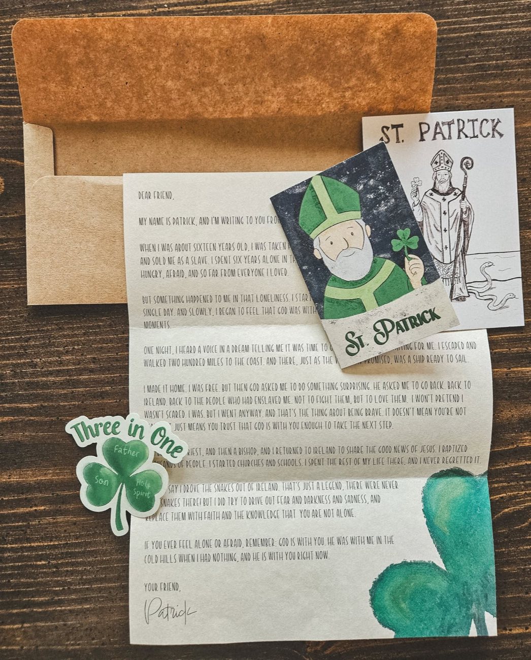 Everything in the March envelope: St. Patrick's hand-drawn letter, prayer card, sticker, and zine
